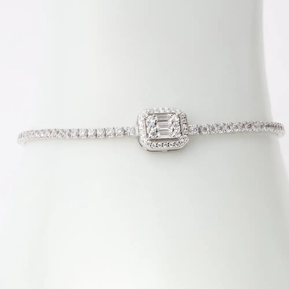 925 silver tennis bracelet featuring a slim band of round cubic zirconia stones and a square centerpiece with baguette-cut stones