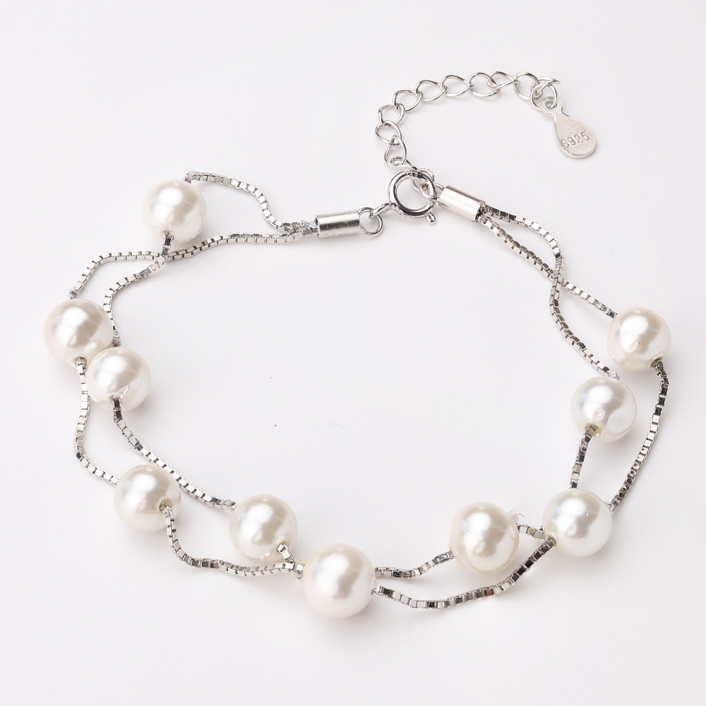 Elegant 925 silver double-strand bracelet with freshwater pearls, adjustable chain, perfect for weddings and special occasions