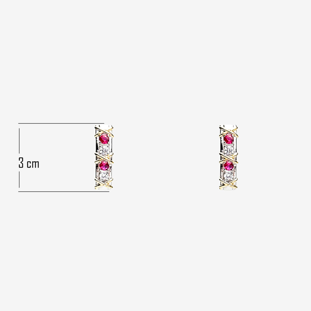 A pair of gold plated bar stud earrings with three vertically aligned round rubies each surrounded by a diamond-shaped halo of clear gemstones. The earrings are approximately 3 centimeters long.