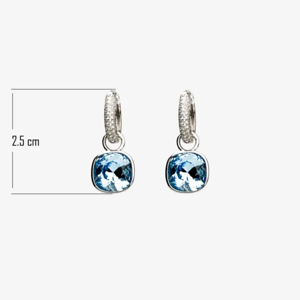 A pair of silver hoop earrings with a smaller diamond-encrusted hoop at the top and a larger, light blue cushion-cut gemstone dangling below, measuring 2.5cm in length.