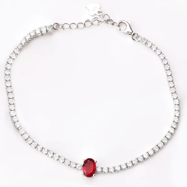 Delicate 925 silver tennis bracelet featuring a row of cubic zirconia stones and a prominent oval-cut red gemstone centerpiece