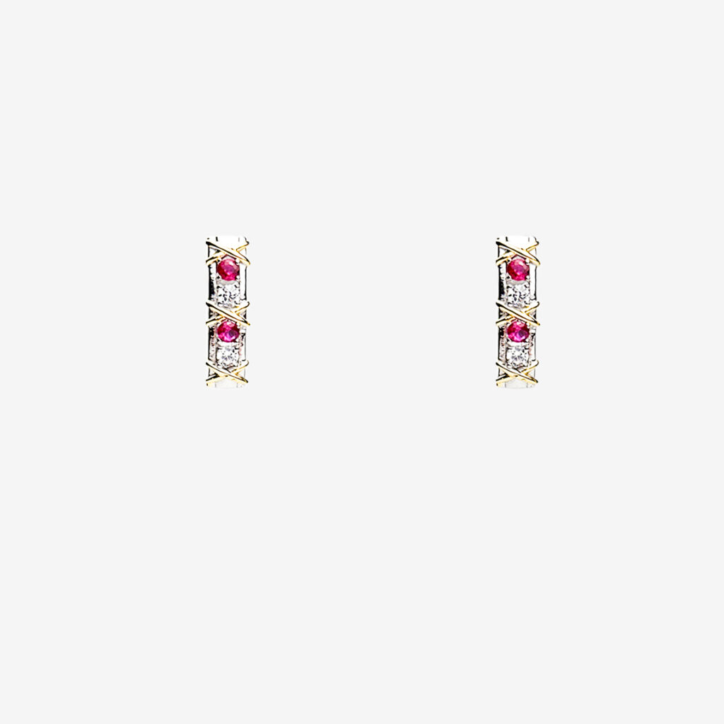 A pair of gold plated stud earrings with three vertically aligned rubies each surrounded by a diamond-shaped halo.