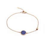 Rose gold-plated sterling silver bracelet with blue enamel charm, top view