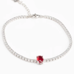 Sterling silver tennis bracelet with ruby CZ centerpiece, front view