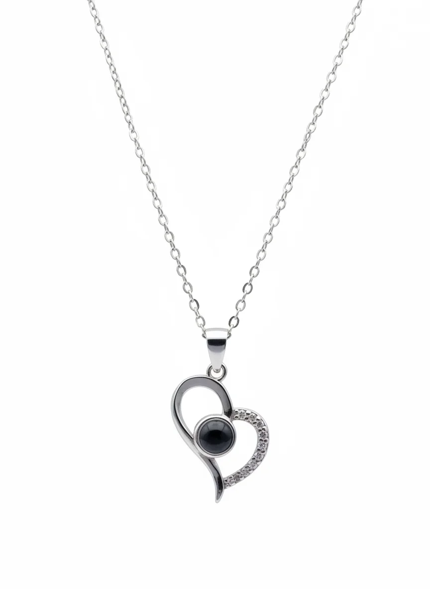 Sterling silver heart pendant with black onyx on chain, front view