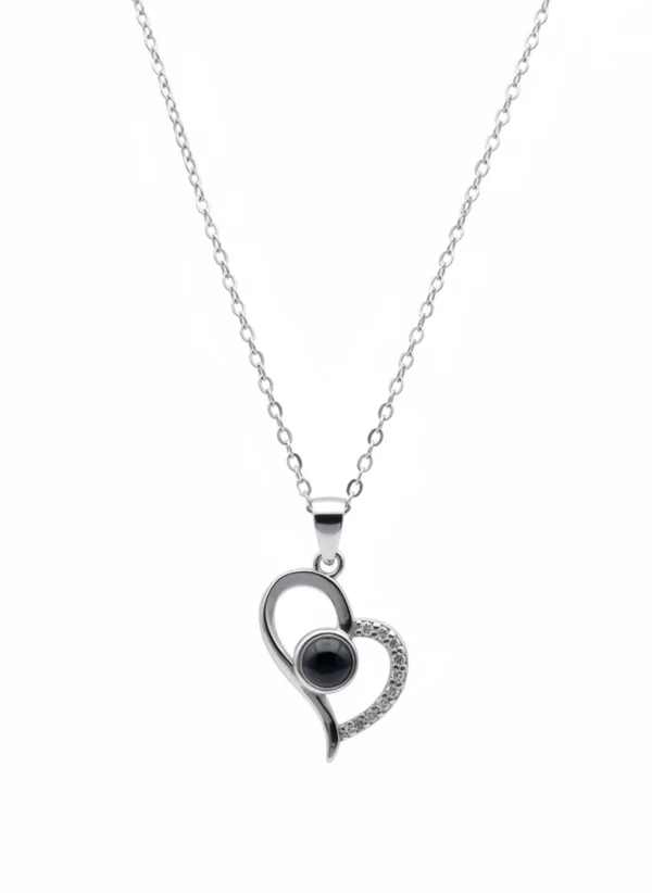 Sterling silver heart pendant with black onyx on chain, front view