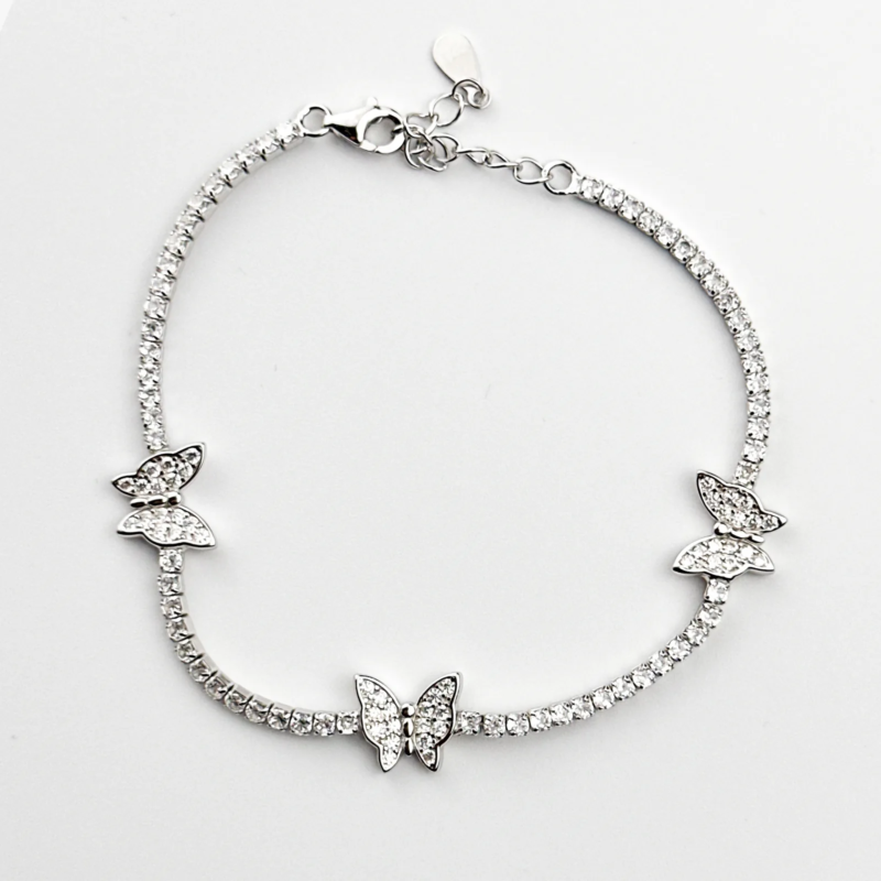 Sterling silver tennis bracelet with butterfly charms, top view