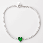 Sterling silver tennis bracelet with heart-shaped emerald and cubic zirconia, top view