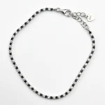 Sterling silver tennis bracelet with black and white cubic zirconia, top view