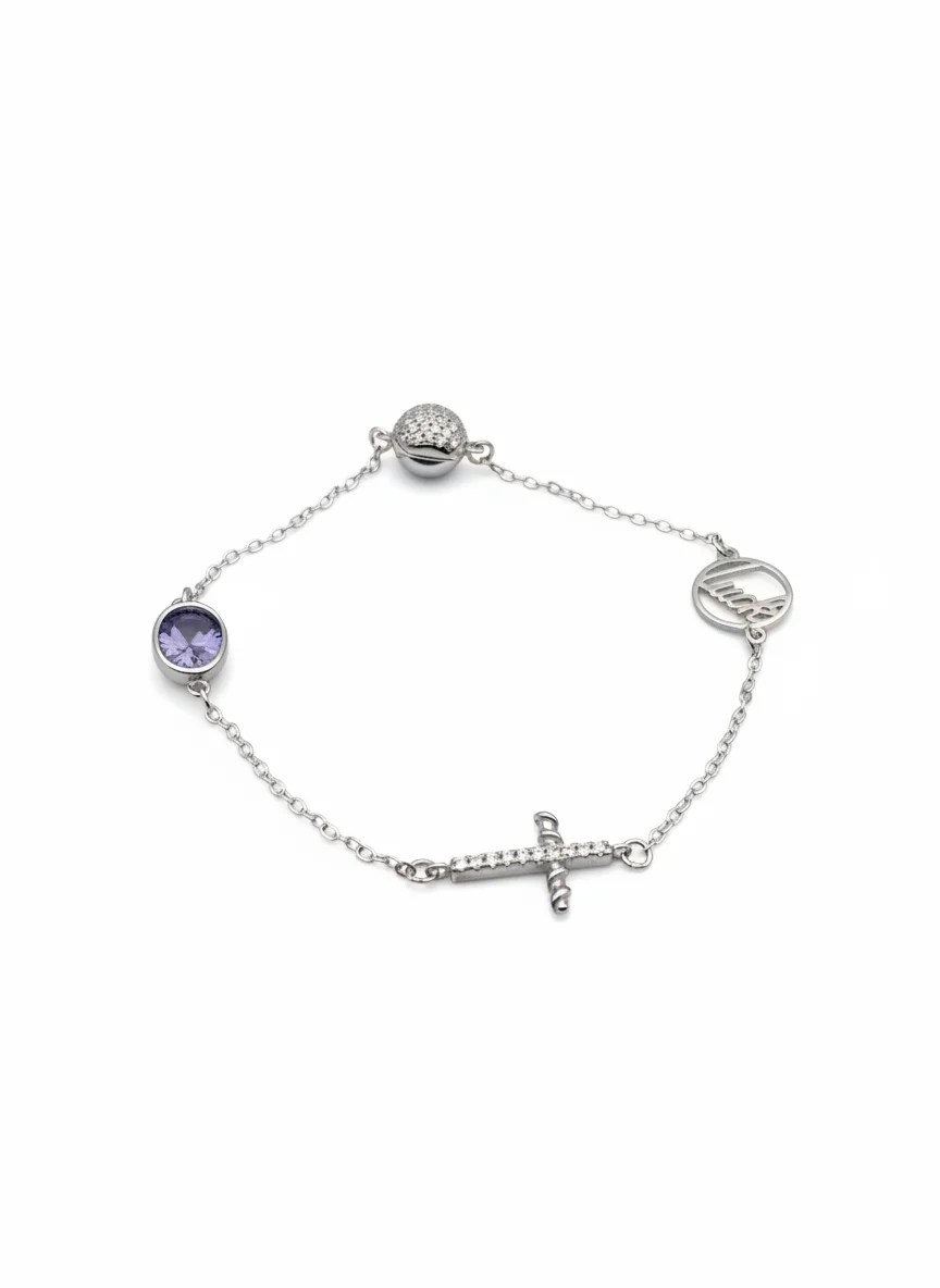 Sterling silver charm bracelet with amethyst accent and cross charm, top view