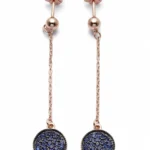 Sterling silver modern dangle earrings with blue stones, front view