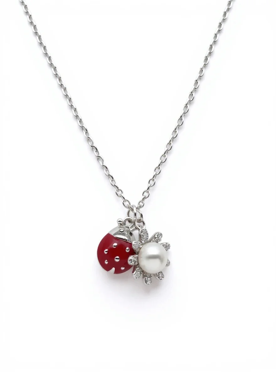 Sterling silver ladybird and flower pendant necklace, front view