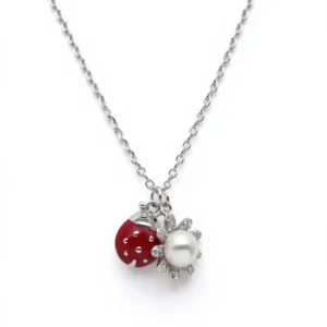 Sterling silver necklace with ladybird and flower pendant, front view