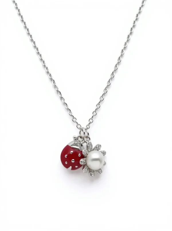 Sterling silver necklace with ladybird and flower pendant, front view