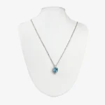 Sterling silver blue topaz heart pendant on chain, front view