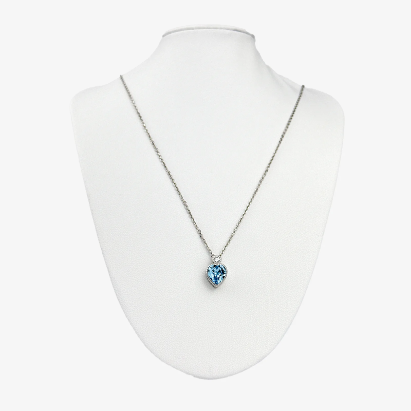 Sterling silver blue topaz heart pendant on chain, front view