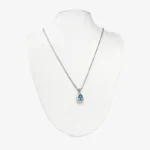 Sterling silver necklace with blue teardrop crystal pendant, front view