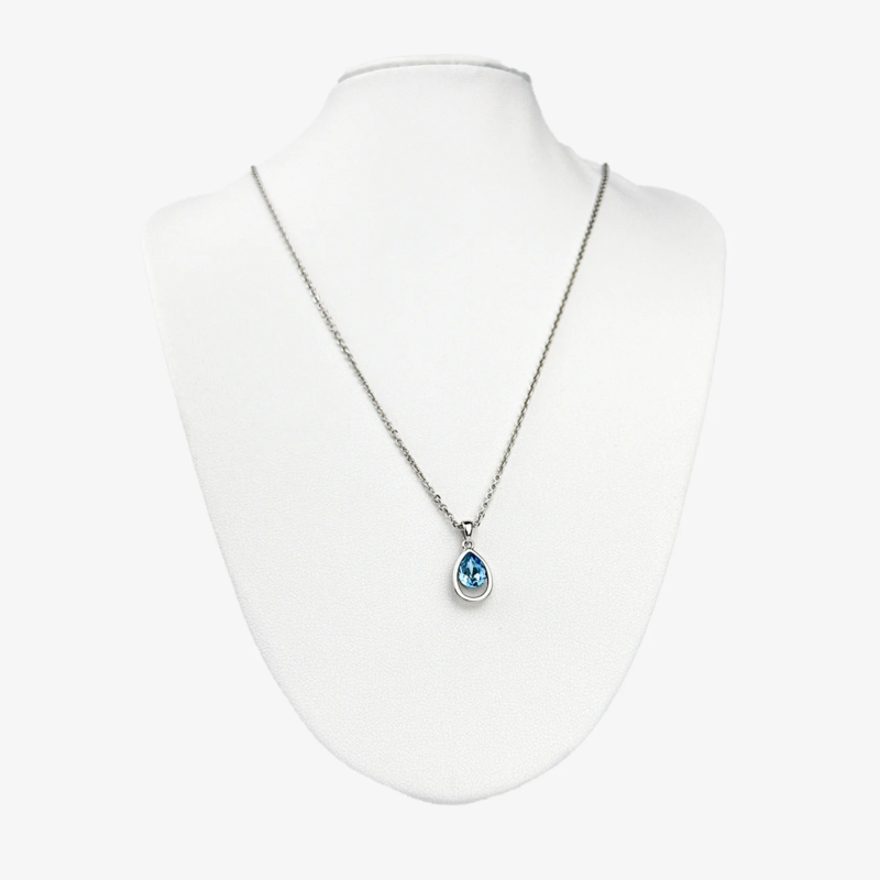 Sterling silver necklace with blue teardrop crystal pendant, front view