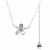 Sterling silver floral pendant necklace with cubic zirconia, front view