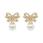Gold-plated sterling silver earrings with bow design and pearl drop, front view