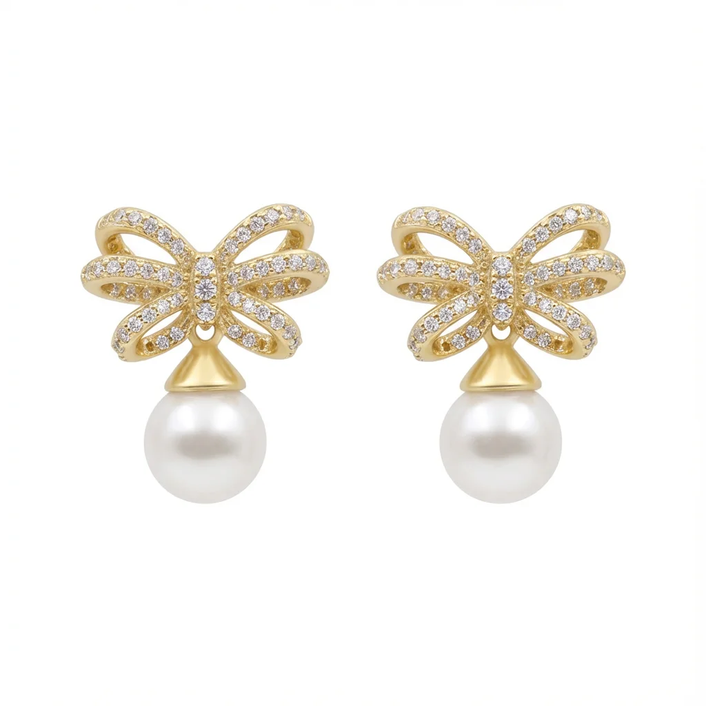Gold-plated sterling silver earrings with bow design and pearl drop, front view