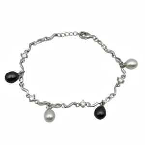 Sterling silver bracelet with wave design and black and white pearls, top view