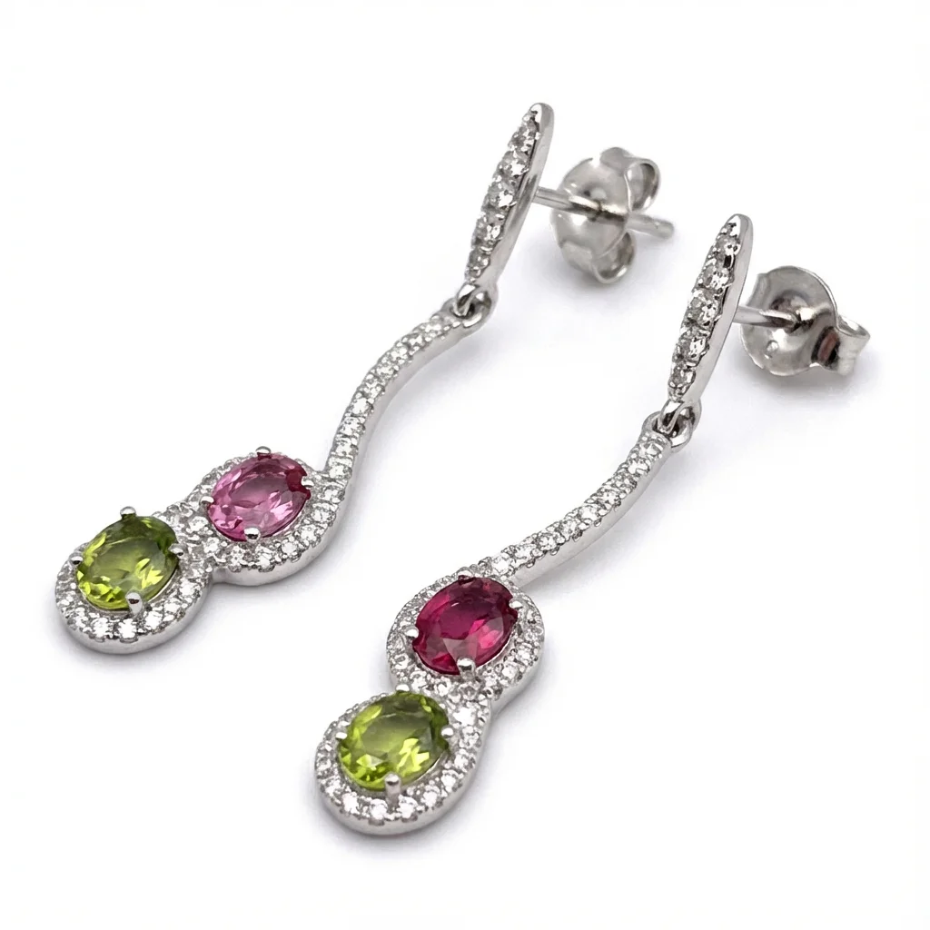 Sterling silver drop earrings with pink and green stones, side view