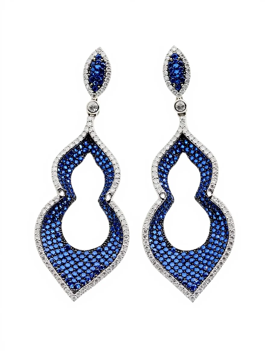 Sterling silver dangle earrings with blue gemstones, front view