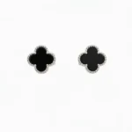 Sterling silver clover stud earrings with black enamel, front view