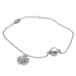 Sterling silver bracelet with clover charm and pearl, front view