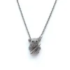 Sterling silver teddy bear pendant on delicate chain, front view