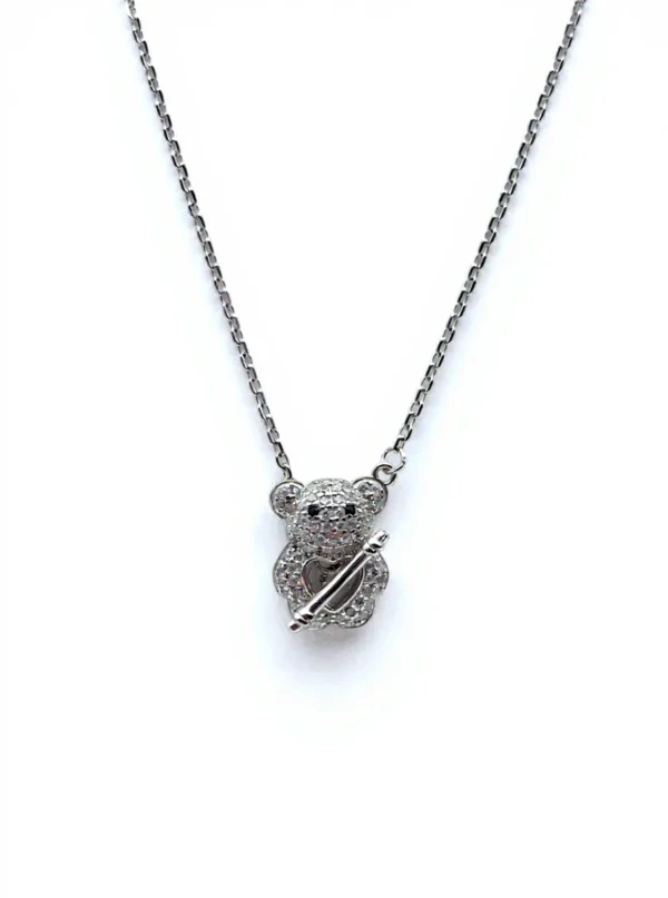 Sterling silver teddy bear pendant on delicate chain, front view