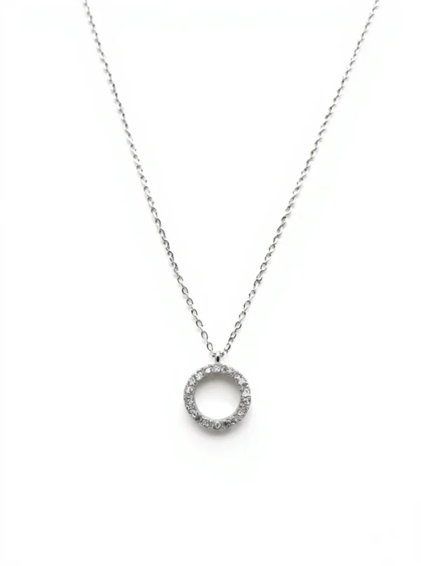 Sterling silver circle pendant necklace with cubic zirconia, front view