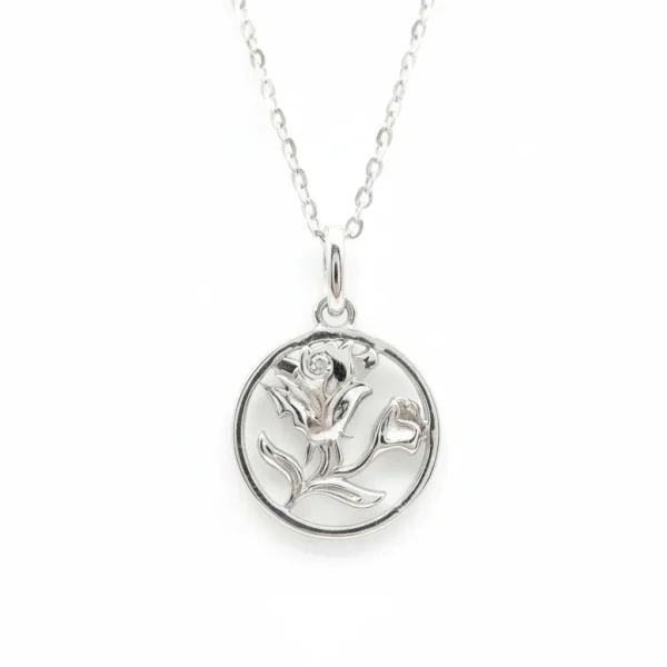 Sterling silver rose pendant on delicate chain, front view