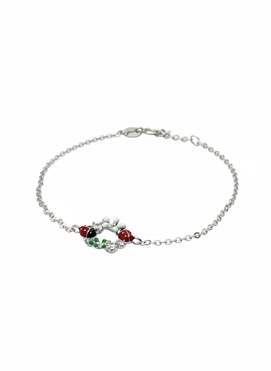 Sterling silver bracelet with ladybird charms, front view