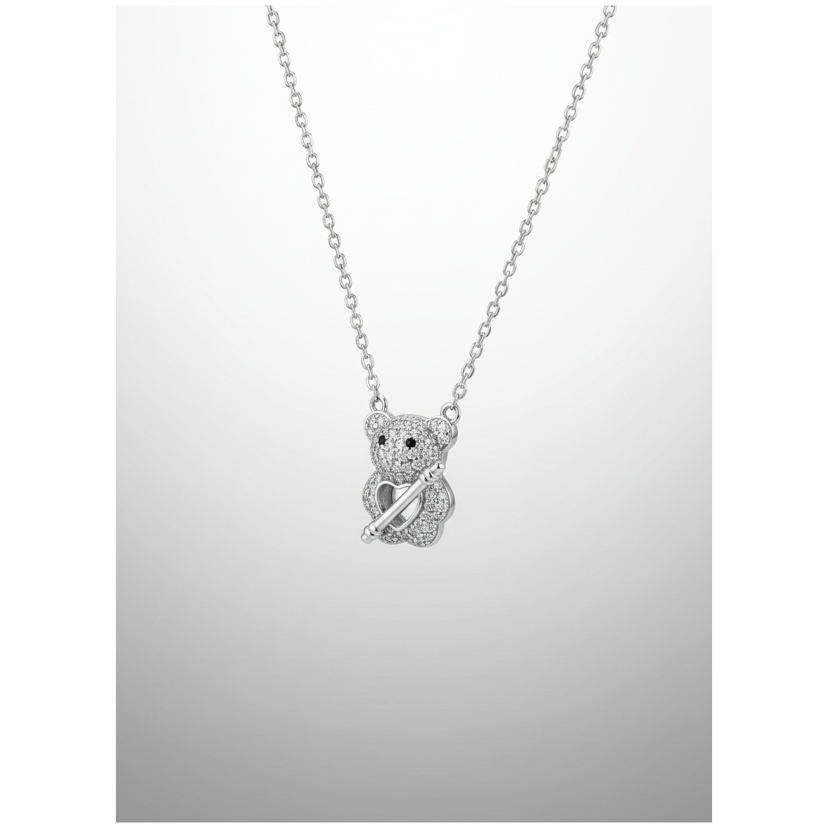 Sterling silver teddy bear pendant on chain, front view