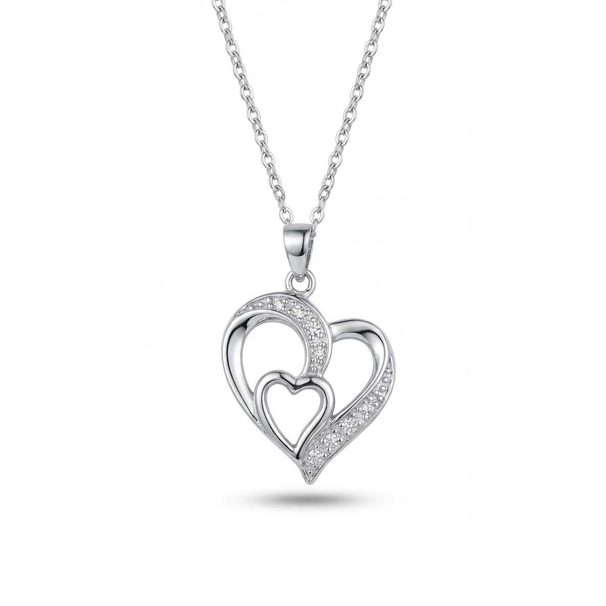 Sterling silver heart pendant with cubic zirconia accents, front view