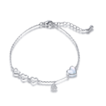 Sterling silver heart charm bracelet with cubic zirconia and white shell, top view
