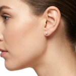 Sterling silver pearl stud earrings with butterfly backs, side view