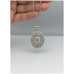Sterling silver religious medallion pendant with intricate design, front view