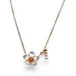 Sterling silver flower pendant necklace with pearl accent, front view