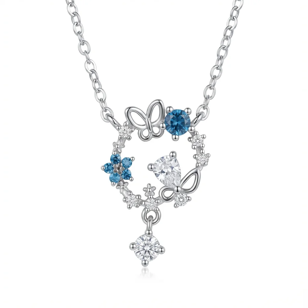 Sterling silver butterfly and floral pendant necklace with blue and clear gemstones, front view
