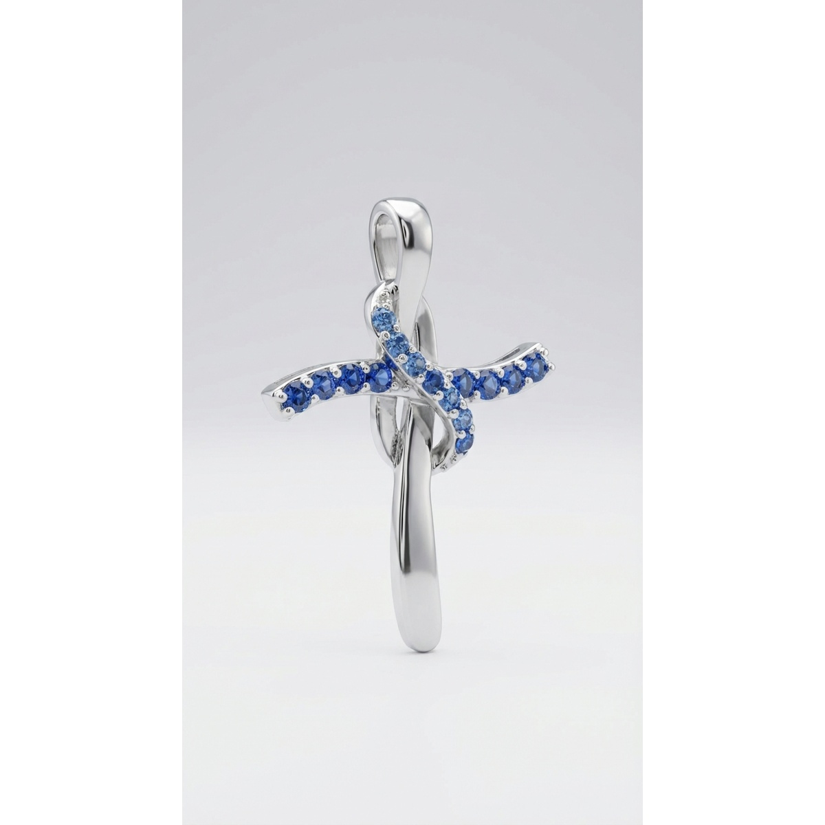 Sterling silver cross pendant with blue gemstones, front view