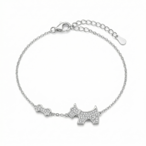 Sterling silver bracelet with dog and bone charms, featuring cubic zirconia, top view