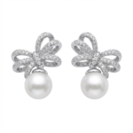 Sterling silver bow earrings with pearls, front view