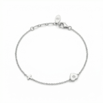 Sterling silver bracelet with heart and cross design, lobster clasp closure