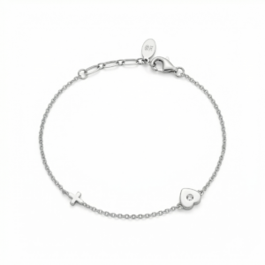 Sterling silver bracelet with heart and cross design, lobster clasp closure