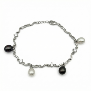 Sterling silver wave bracelet with black and white pearls, top view