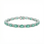 Sterling silver tennis bracelet with emerald stones, front view