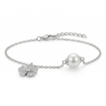 Sterling silver bracelet with clover charm and pearl, side view